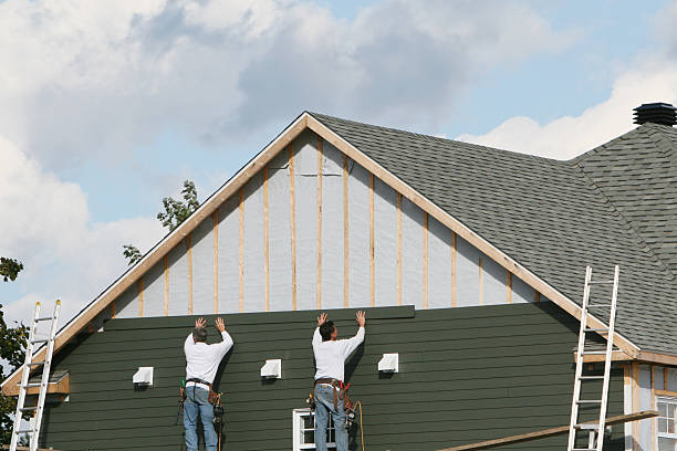 Professional Siding Installation technician working in Louisa, VA